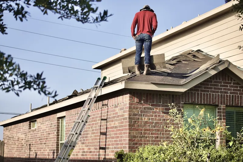 Professional roofer working on a residential roof in Deerpath